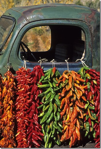 Colorful chile ristras hang from the window of an old pickup at Elizabeth Berry's ranch near the village of Abiquiu in northern New Mexico