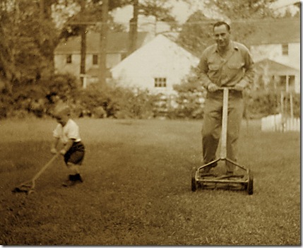 Me and my Pop mowing the lawn circa 1955