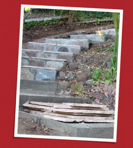 Steps leading to the garden are being paved with flagstone. 