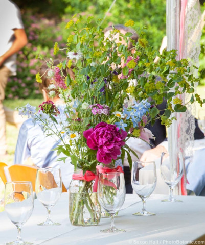 Fresh local flowers in mason jar bouquets on Annie's wedding day